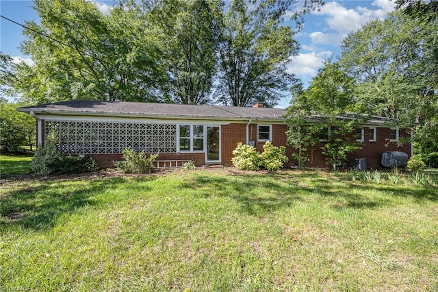 610 Frye Bridge Rd, Clemmons, NC 27012 - rear view of house with a yard, brick siding, and a chimney
