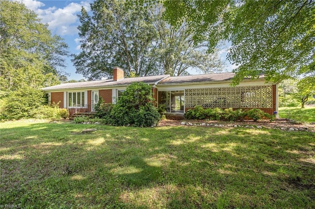 610 Frye Bridge Rd, Clemmons, NC 27012 - view of front of home featuring brick siding, a front lawn, and a chimney