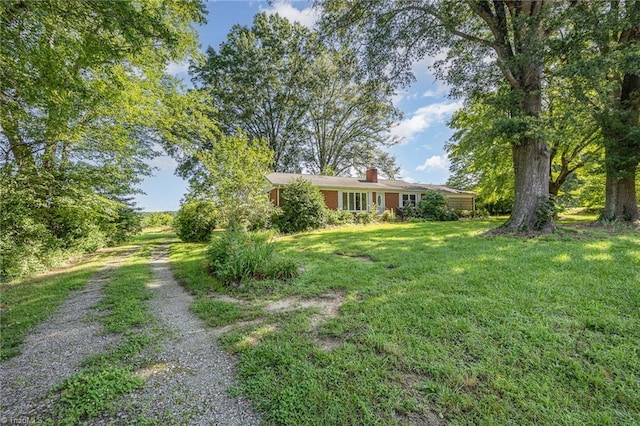 610 Frye Bridge Rd, Clemmons, NC 27012 - view of front of house with a front lawn, a chimney, and driveway