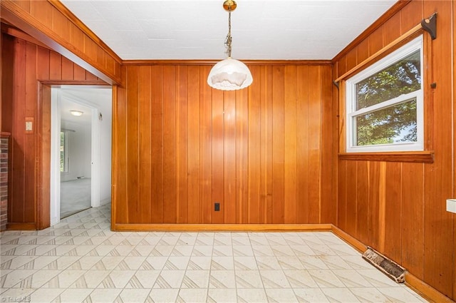 610 Frye Bridge Rd, Clemmons, NC 27012 - unfurnished dining area with healthy amount of natural light, wooden walls, and light floors