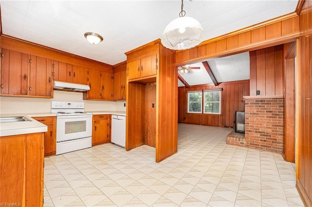 610 Frye Bridge Rd, Clemmons, NC 27012 - kitchen with white appliances, under cabinet range hood, a wood stove, wood walls, and light countertops