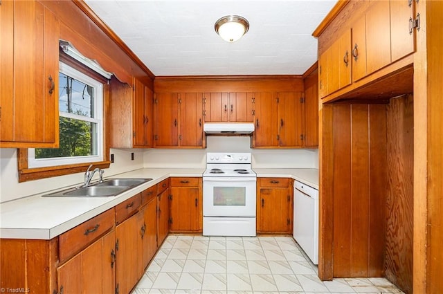 610 Frye Bridge Rd, Clemmons, NC 27012 - kitchen with white appliances, under cabinet range hood, brown cabinets, light countertops, and crown molding