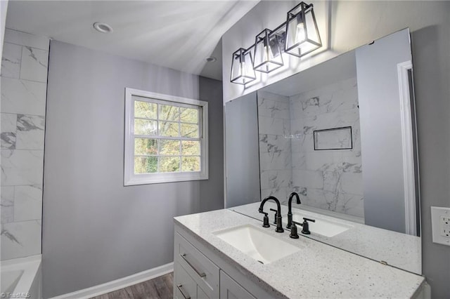 bathroom featuring wood-type flooring and vanity