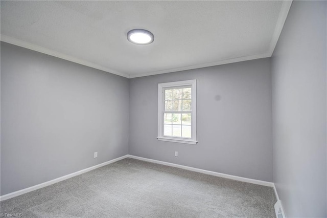 carpeted empty room with crown molding