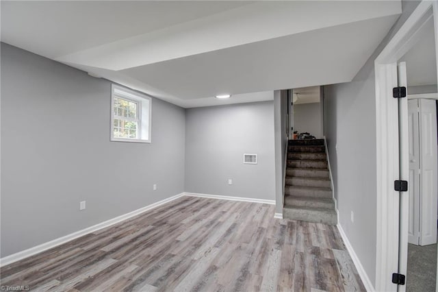 basement with light wood-type flooring