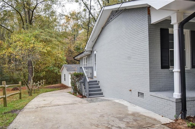 1638 Colonial Dr, Salisbury, NC 28144 - view of home's exterior featuring brick siding, a patio area, and crawl space
