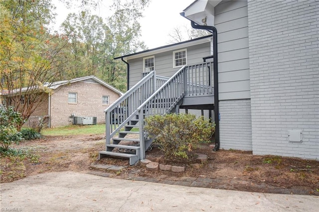 entrance to property featuring central air condition unit