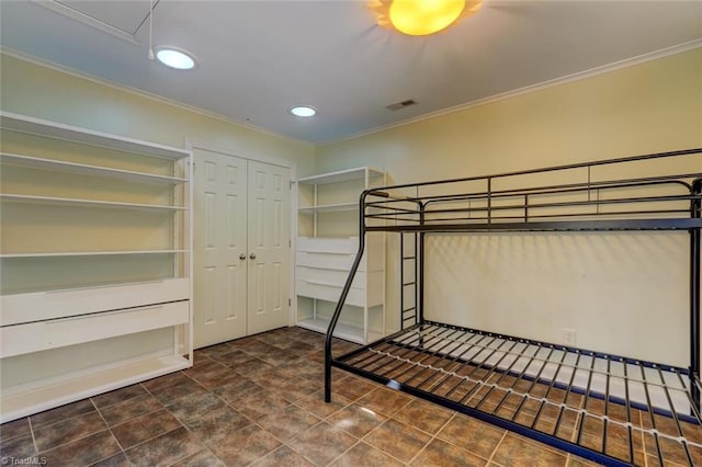 unfurnished bedroom featuring visible vents, recessed lighting, crown molding, and a closet