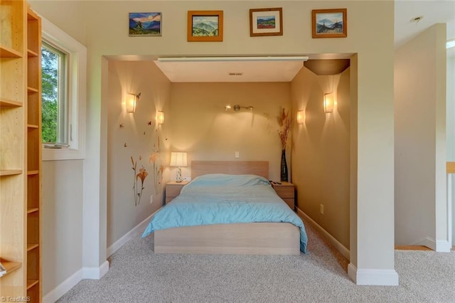 bedroom with carpet floors and baseboards