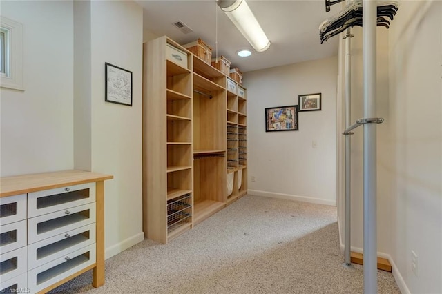 spacious closet featuring carpet floors and visible vents