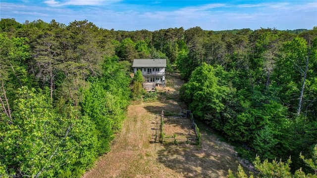 aerial view featuring a wooded view