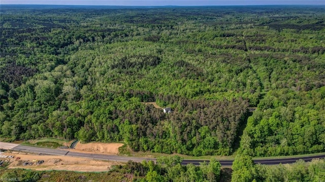 bird's eye view featuring a forest view