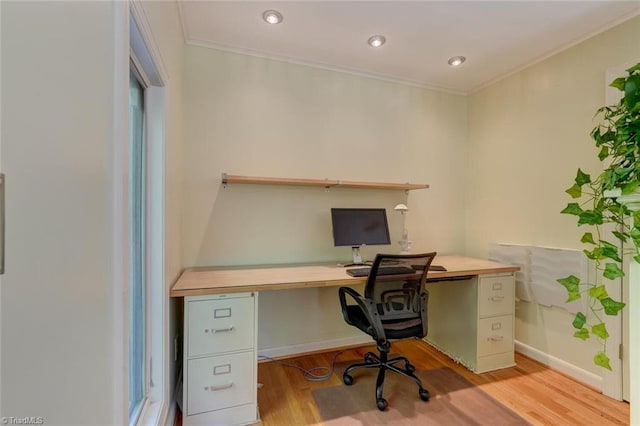 office space with recessed lighting, baseboards, ornamental molding, and light wood-type flooring