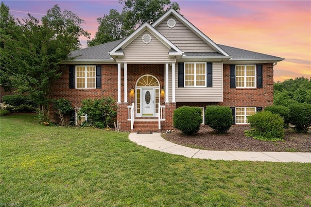 5921 Election Oak Dr, High Point, NC 27265 - split foyer home featuring a front yard and brick siding
