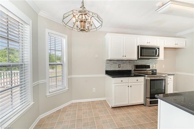 5921 Election Oak Dr, High Point, NC 27265 - kitchen with stainless steel appliances, a chandelier, plenty of natural light, decorative backsplash, and ornamental molding