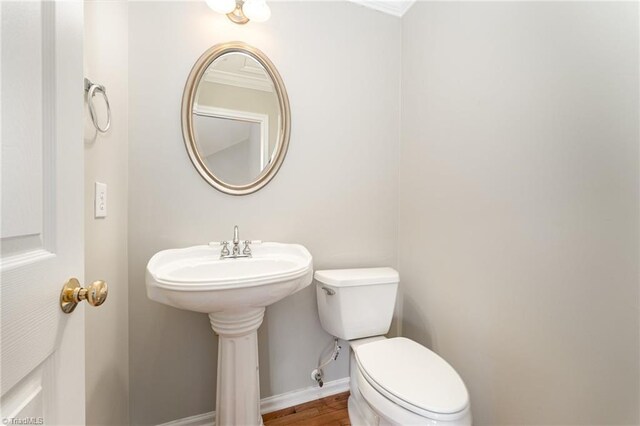 5921 Election Oak Dr, High Point, NC 27265 - half bathroom with toilet, baseboards, wood finished floors, and ornamental molding