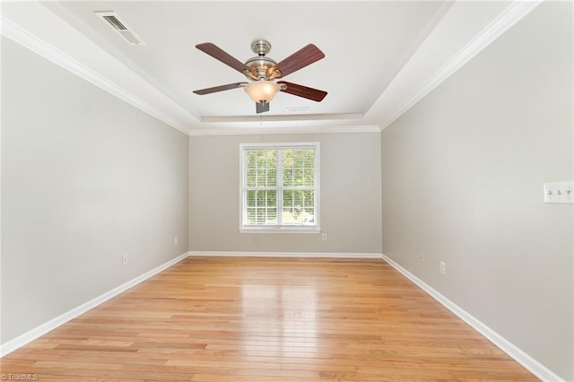 5921 Election Oak Dr, High Point, NC 27265 - unfurnished room with light wood-style flooring, ceiling fan, baseboards, crown molding, and a tray ceiling