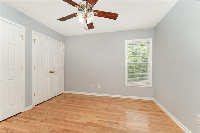 5921 Election Oak Dr, High Point, NC 27265 - unfurnished bedroom with light wood-type flooring, baseboards, and ceiling fan