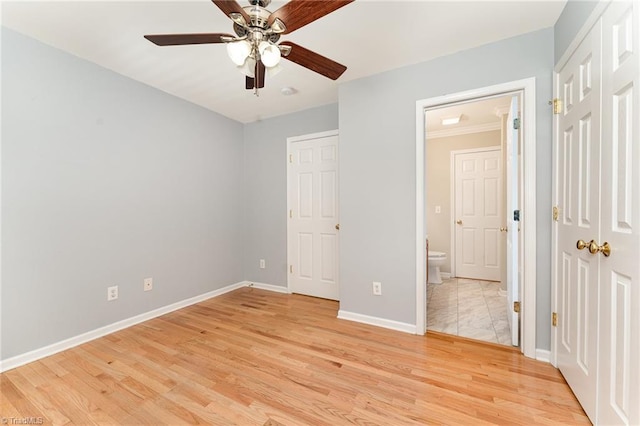 5921 Election Oak Dr, High Point, NC 27265 - unfurnished bedroom featuring light wood-type flooring, baseboards, connected bathroom, and ceiling fan