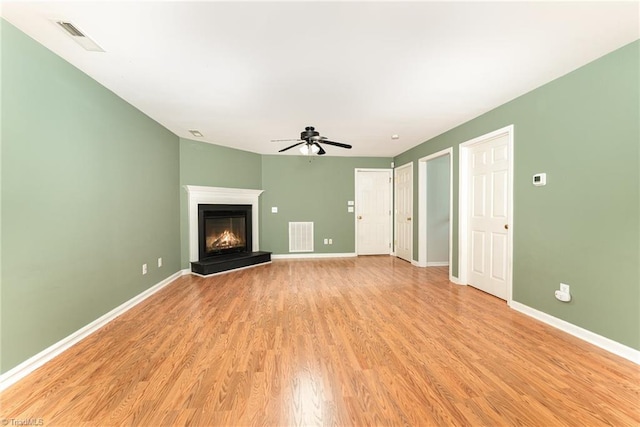 5921 Election Oak Dr, High Point, NC 27265 - unfurnished living room with ceiling fan, light wood finished floors, and baseboards