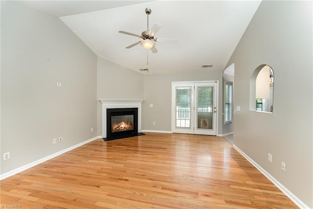 5921 Election Oak Dr, High Point, NC 27265 - unfurnished living room with light wood finished floors, ceiling fan, lofted ceiling, a fireplace with flush hearth, and baseboards