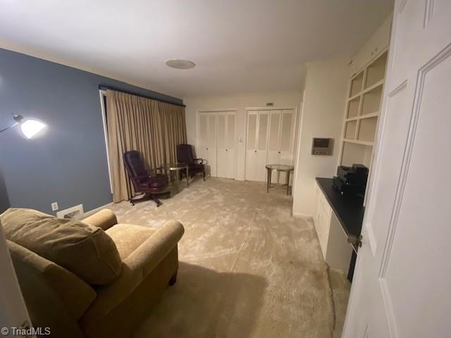 living room with light colored carpet