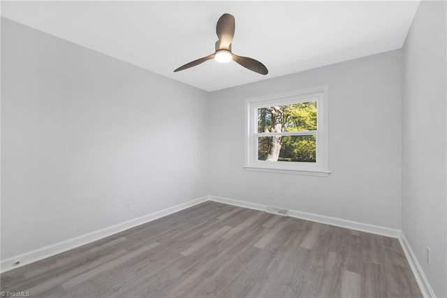 unfurnished room with light hardwood / wood-style flooring and ceiling fan