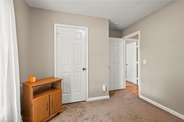 7145 Franklin Rd, Lewisville, NC 27023 - unfurnished bedroom with light carpet and a textured ceiling
