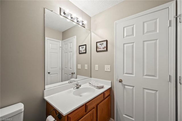 7145 Franklin Rd, Lewisville, NC 27023 - bathroom with vanity and a textured ceiling