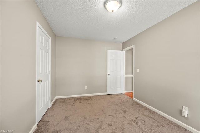 7145 Franklin Rd, Lewisville, NC 27023 - unfurnished bedroom with a textured ceiling and carpet