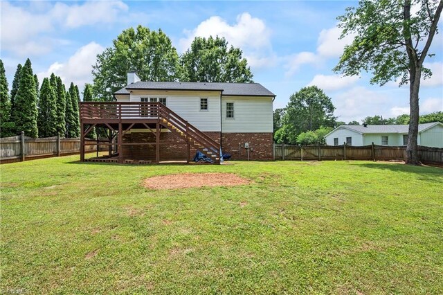 7145 Franklin Rd, Lewisville, NC 27023 - rear view of house featuring stairs, a fenced backyard, a wooden deck, and brick siding