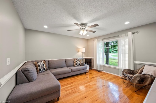 7145 Franklin Rd, Lewisville, NC 27023 - living room featuring light wood-style flooring, a ceiling fan, a textured ceiling, and recessed lighting
