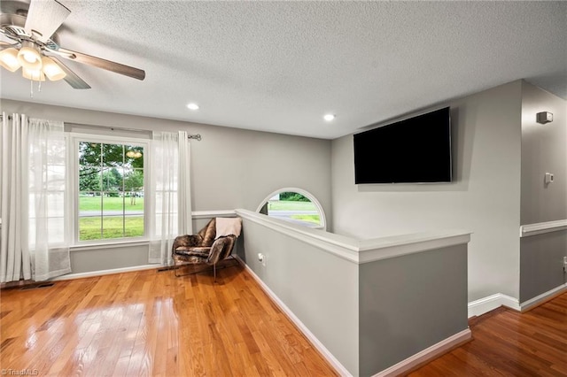 7145 Franklin Rd, Lewisville, NC 27023 - living area with a textured ceiling, wood finished floors, ceiling fan, and recessed lighting