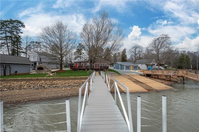 dock area featuring a residential view and a water view