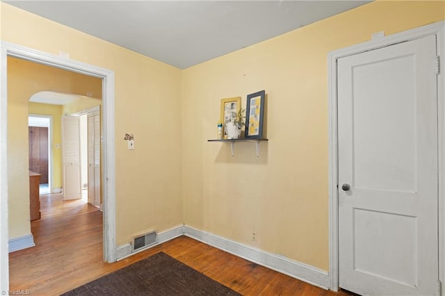 spare room with hardwood / wood-style floors