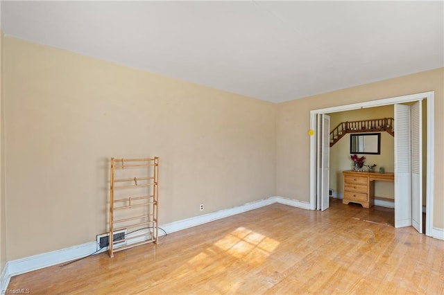 unfurnished room featuring light hardwood / wood-style floors