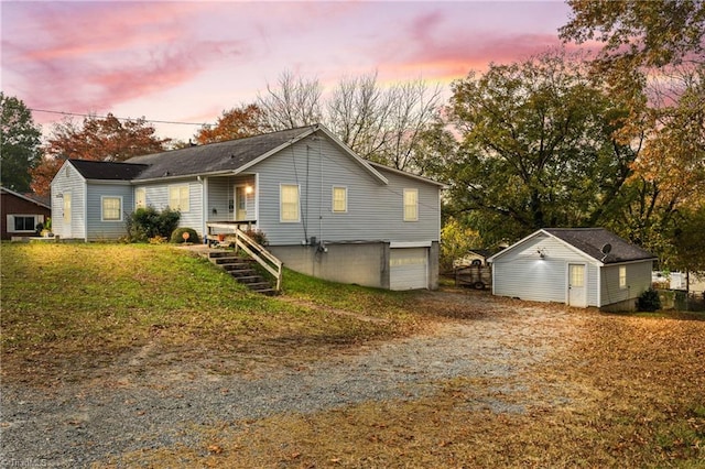 view of front of home featuring a lawn and a garage