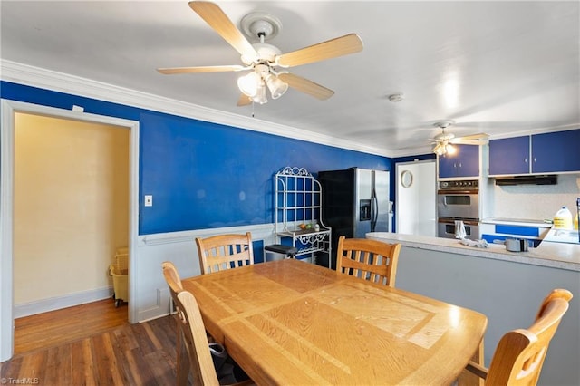 dining area with dark hardwood / wood-style floors, ceiling fan, and crown molding