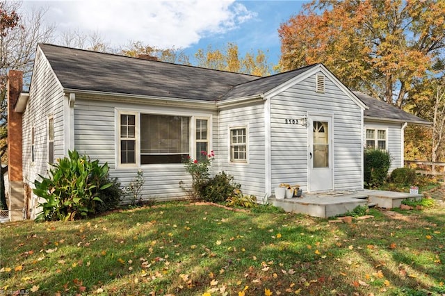 view of front of home with a front yard