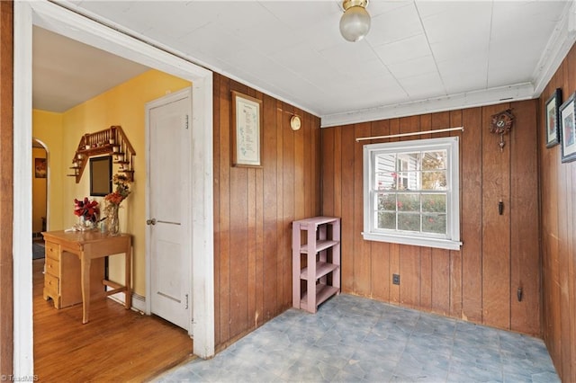 interior space with wood walls and wood-type flooring