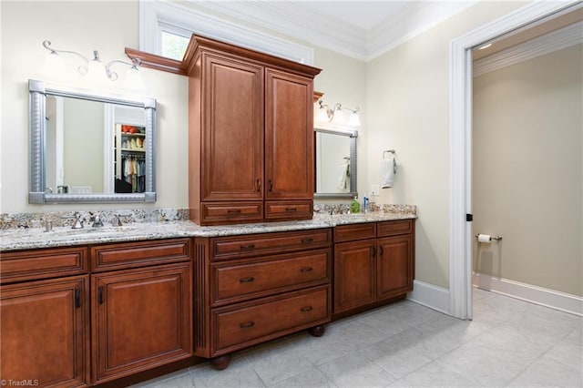 bathroom featuring ornamental molding and vanity