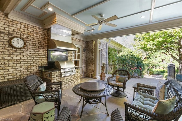 view of patio with area for grilling, a grill, and ceiling fan