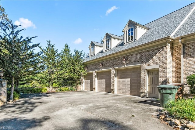 view of property exterior with a garage