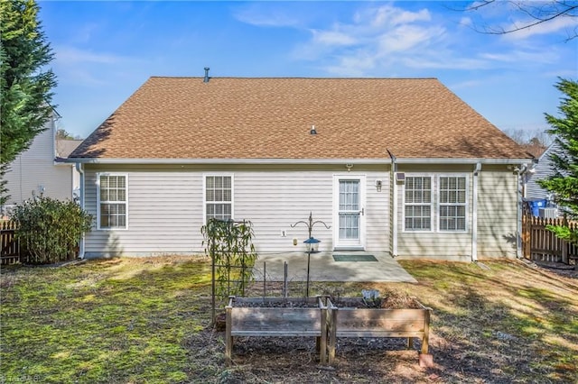 back of house with a yard and a patio area