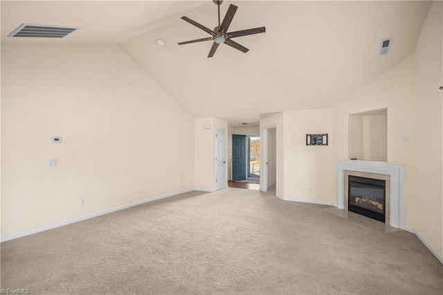 unfurnished living room featuring light carpet, high vaulted ceiling, and ceiling fan