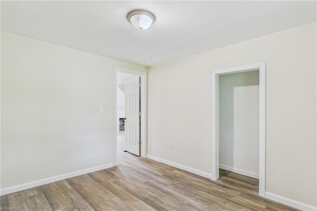3885 Leo St, Winston-Salem, NC 27105 - unfurnished room featuring wood finished floors and baseboards