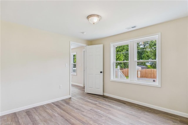 3885 Leo St, Winston-Salem, NC 27105 - unfurnished room featuring plenty of natural light and light wood-type flooring
