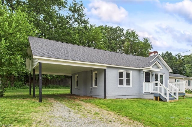 3885 Leo St, Winston-Salem, NC 27105 - ranch-style house with a shingled roof, driveway, a front yard, a chimney, and a carport
