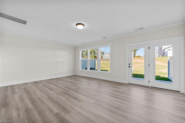 empty room with light wood-type flooring and baseboards