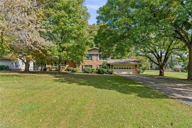 view of front of house featuring a garage and a front yard